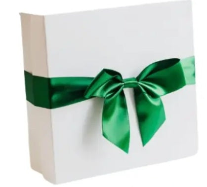 White box with a green ribbon on a white background