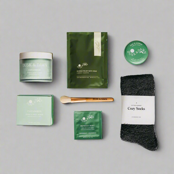 Collection of bath and body products including a jar, soap, and socks on a white background